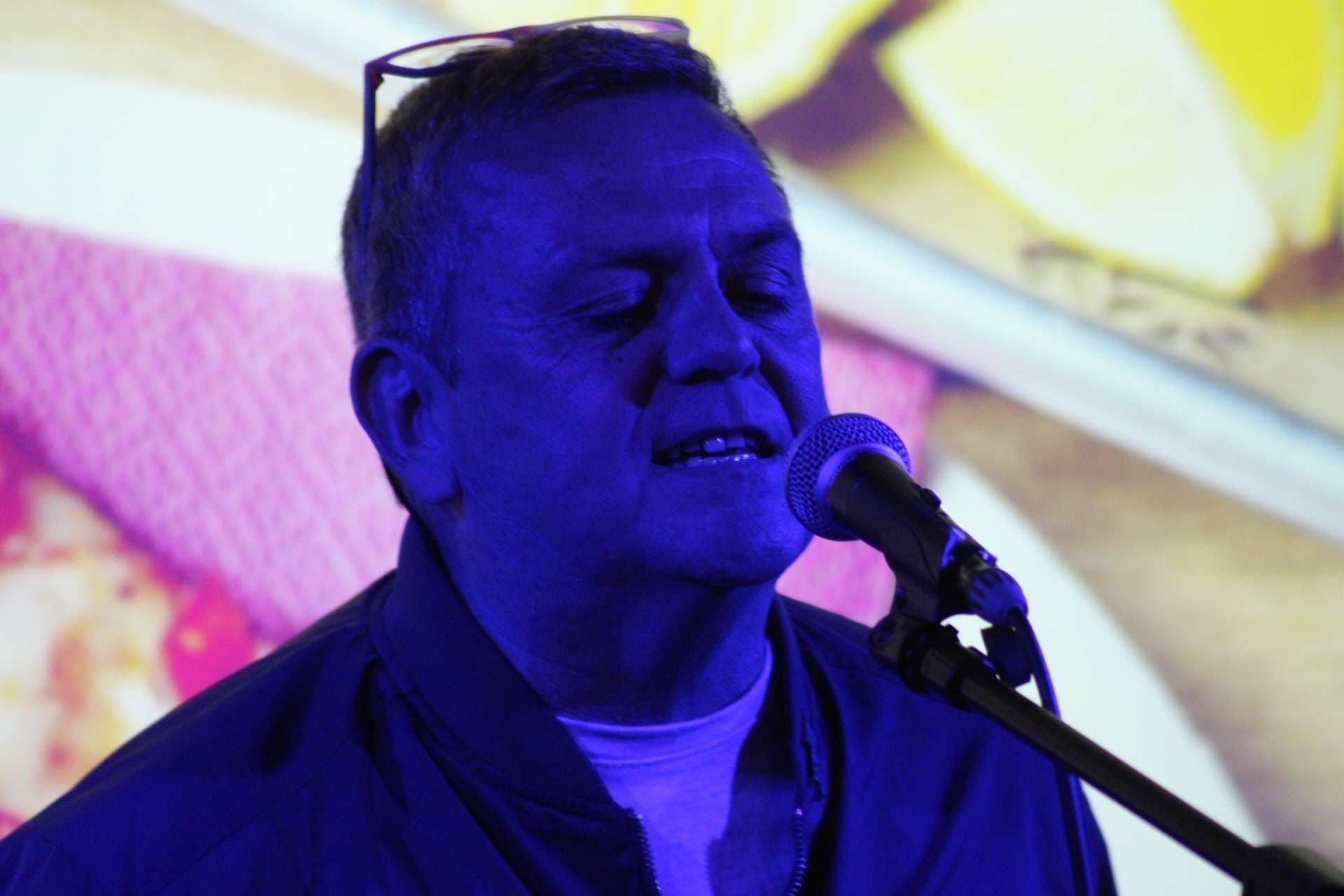 Man performing at All Ears spoken word poetry event